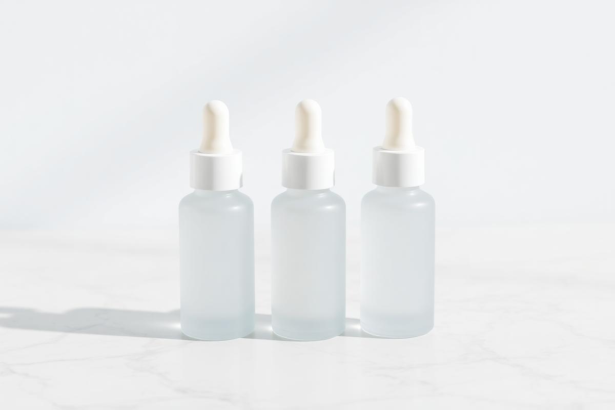 Frosted glass bottle of The Dosed Collective GHK-Cu copper peptide serum
